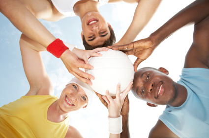 Athletes Holding a Volleyball